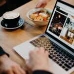 Person Using Macbook Showing Photos