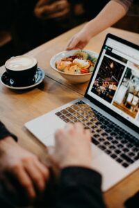 Person Using Macbook Showing Photos